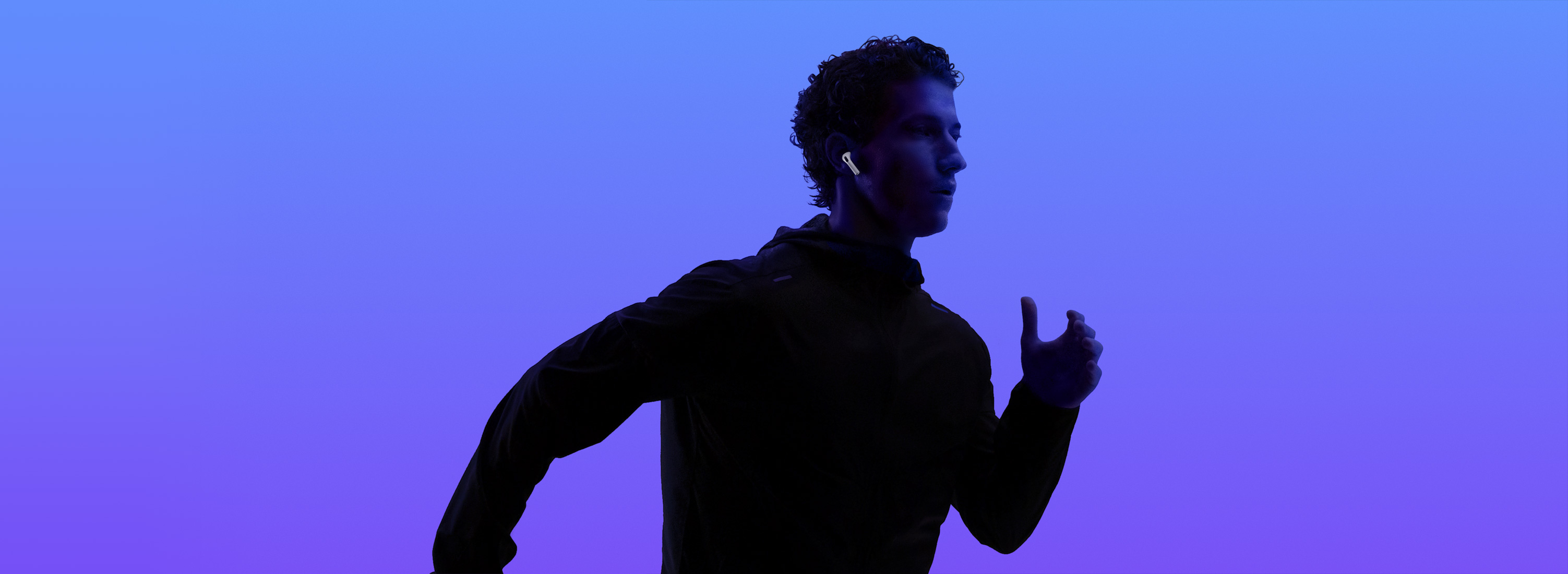 Man with airpod in blue background
